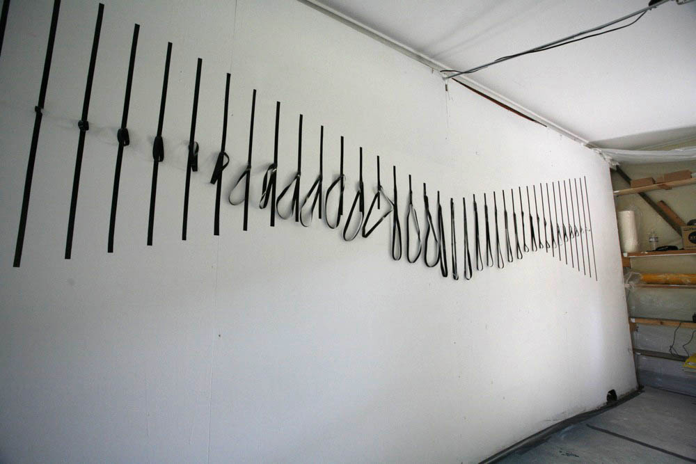 Cut vinyl on wall. 36" x 444", 2008.